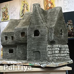 additive sculptures of miniature houses