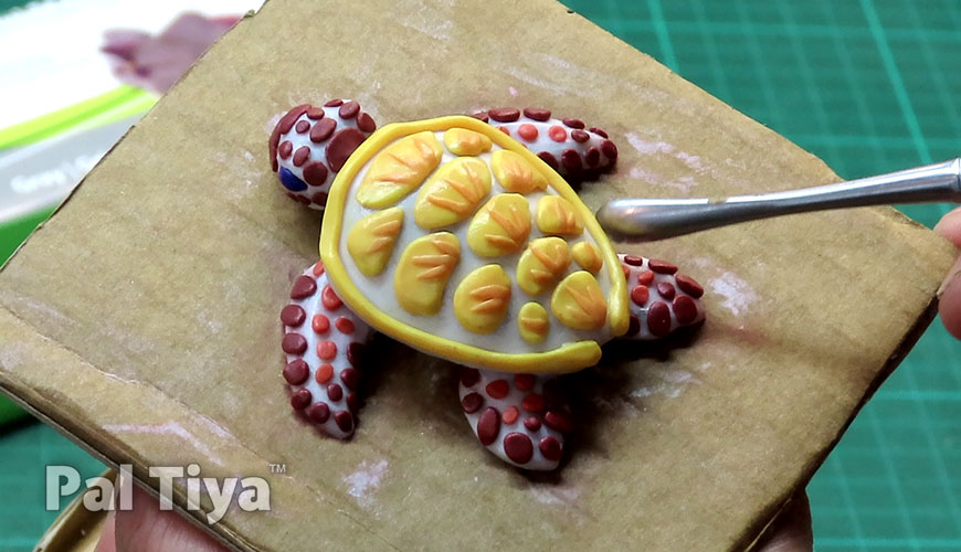 How do I bake my polymer clay sculptures? 